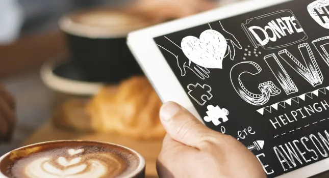 Person on a tablet with coffee