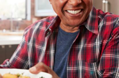 african american male passing a bowl of food
